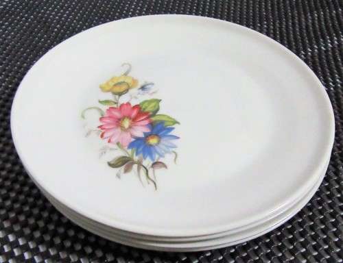 FOUR GORGEOUS PIONEER PORCELAIN SIDE PLATES DECORATED WITH BEAUTIFUL BRIGHT FLOWERS BID PER EACH