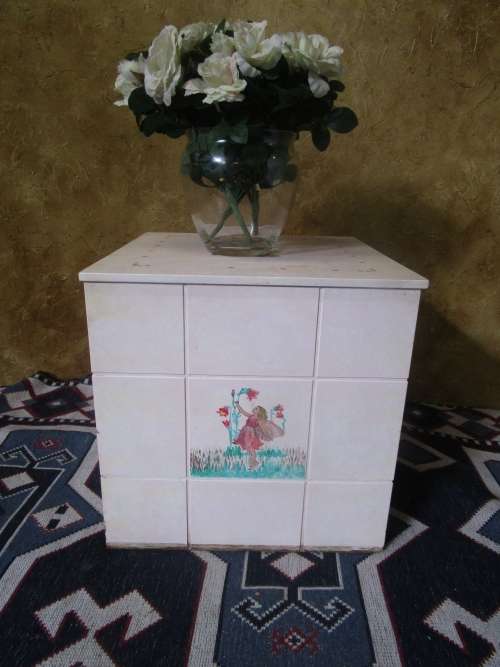 A CUTE PAINTED KIST PERFECT FOR KIDS ROOM TO STORE ALL THE TOYS