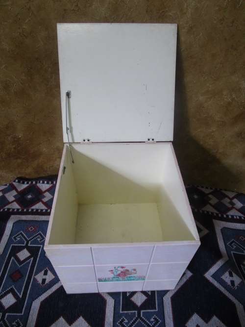 A CUTE PAINTED KIST PERFECT FOR KIDS ROOM TO STORE ALL THE TOYS