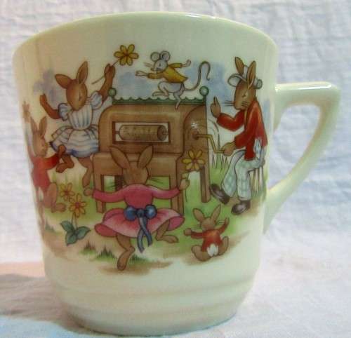 This is a "Bunnykins" child's mug and saucer set by Royal Doulton China. The set is perfect