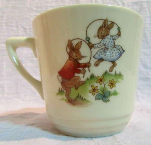 This is a "Bunnykins" child's mug and saucer set by Royal Doulton China. The set is perfect