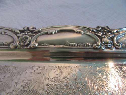 A Stylish Vintage rectangular silver plated tray. The base has ornate chased decoration and a raise