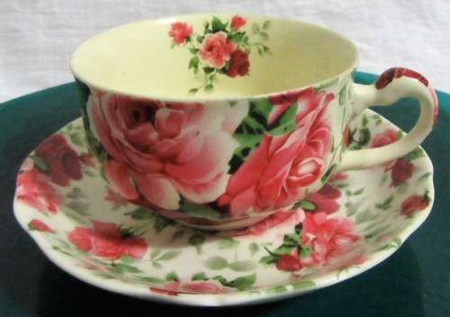A STUNNING FLORAL VICTORIAN ROSE CUP & SAUCER BY WILLIAM JAMES -