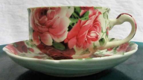 A STUNNING FLORAL VICTORIAN ROSE CUP & SAUCER BY WILLIAM JAMES -