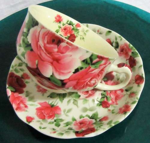 A STUNNING FLORAL VICTORIAN ROSE CUP & SAUCER BY WILLIAM JAMES -