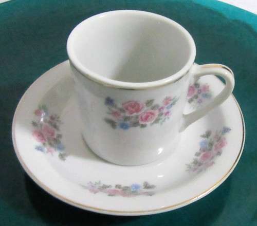 TWO ELEGANT PORCELAIN DEMITASSE CUPA & SAUCERS WITH A LOVLEY FLORAL DESIGN PERFECT FOR A EXPRESSO