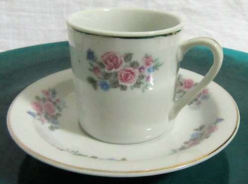 TWO ELEGANT PORCELAIN DEMITASSE CUPA & SAUCERS WITH A LOVLEY FLORAL DESIGN PERFECT FOR A EXPRESSO