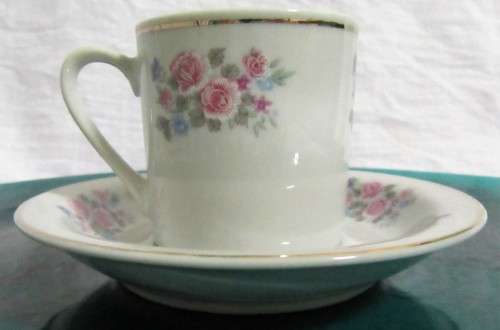 TWO ELEGANT PORCELAIN DEMITASSE CUPA & SAUCERS WITH A LOVLEY FLORAL DESIGN PERFECT FOR A EXPRESSO