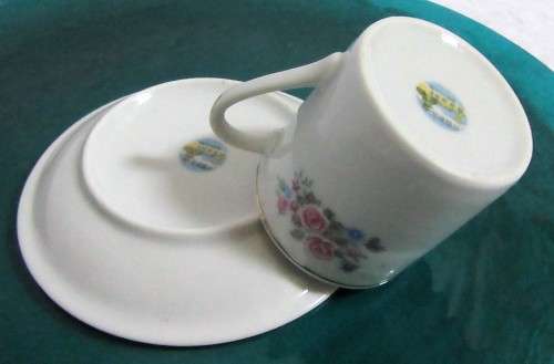 TWO ELEGANT PORCELAIN DEMITASSE CUPA & SAUCERS WITH A LOVLEY FLORAL DESIGN PERFECT FOR A EXPRESSO