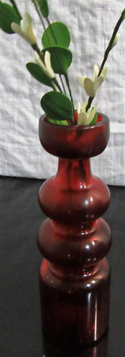 Very unusual red glass candle  holder or vase - pretty striking and different.
