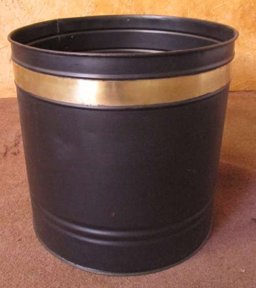 A RUSTIC LARGE METAL LOCK BIN WRAPPED WITH A SHINEY BRASS BAND