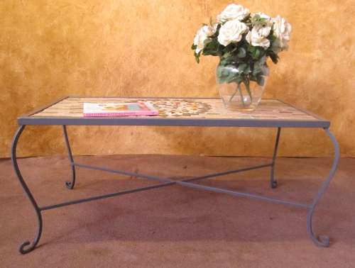 A GORGEOUS OUTDOOR TABLE WITH STEEL LEGS AND FRAME WITH A SOLLID MOSAIC TOP