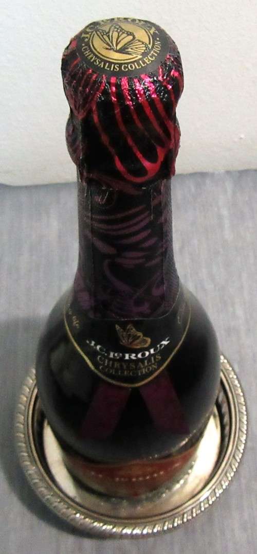 Two Vintage silver plated engraved, galleried champagne or wine bottle coaster