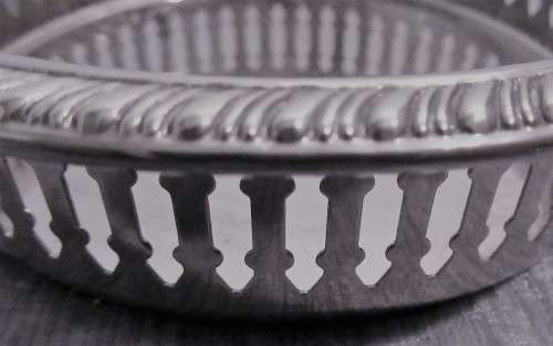 Two Vintage silver plated engraved, galleried champagne or wine bottle coaster