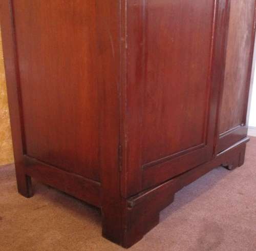 A TWO DOOR VINTAGE WARDROBE WITH HANGING SPACE AND DRAWERS