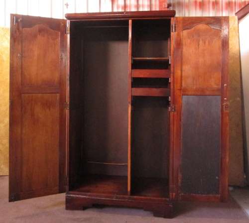 A TWO DOOR VINTAGE WARDROBE WITH HANGING SPACE AND DRAWERS