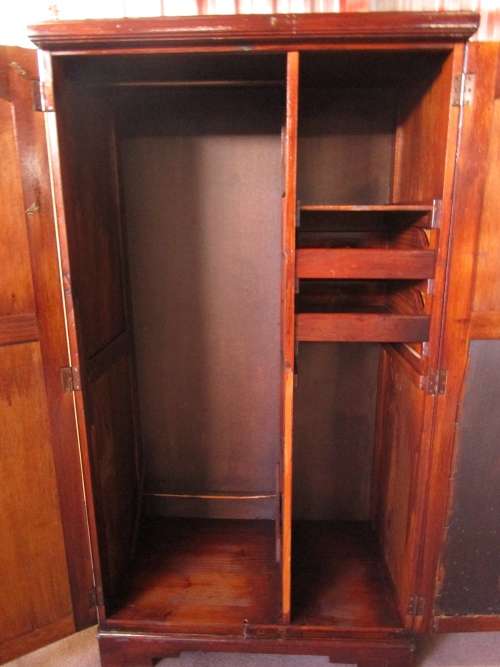 A TWO DOOR VINTAGE WARDROBE WITH HANGING SPACE AND DRAWERS