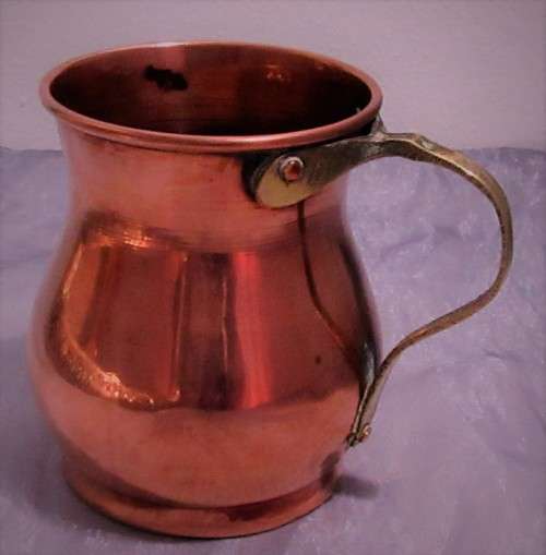 Four attractive antique tin-lined half pint copper mug or tankard with a brass handle.