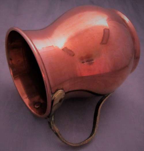 Four attractive antique tin-lined half pint copper mug or tankard with a brass handle.