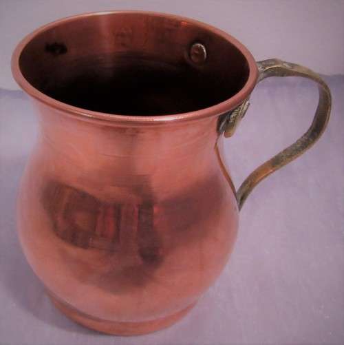 Four attractive antique tin-lined half pint copper mug or tankard with a brass handle.