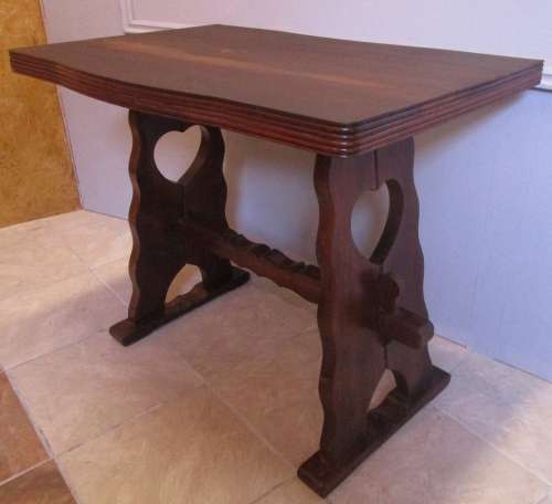 A LOVELY FOUR SEATER WITH STUNNING LEGS WITH A HEART CUT OUT IN THE LEGS