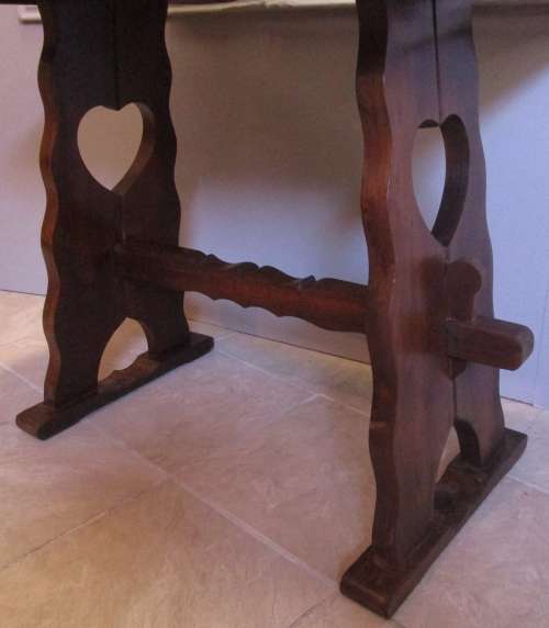 A LOVELY FOUR SEATER WITH STUNNING LEGS WITH A HEART CUT OUT IN THE LEGS