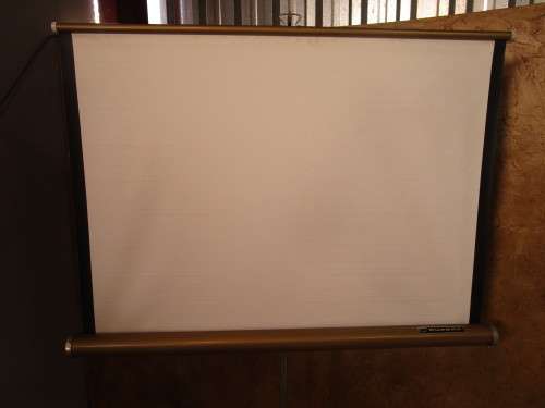 A MARVELOUS VINTAGE PROJECTOR SCREEN IN GOOD CONDITION