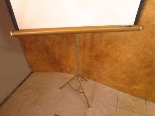 A MARVELOUS VINTAGE PROJECTOR SCREEN IN GOOD CONDITION