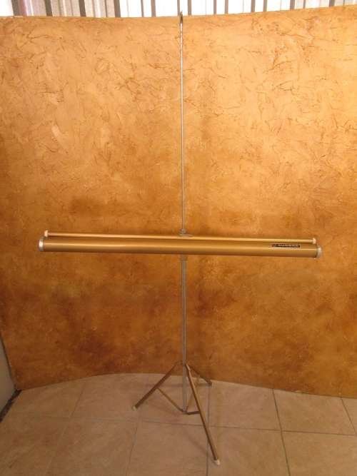 A MARVELOUS VINTAGE PROJECTOR SCREEN IN GOOD CONDITION