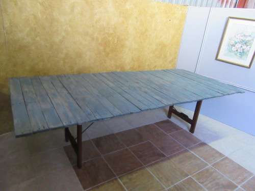 A TRENDY 12 SEATER FOLD UP TABLE WITH A SOLID WOOD FRAME AND SHABBY CHIC TOP