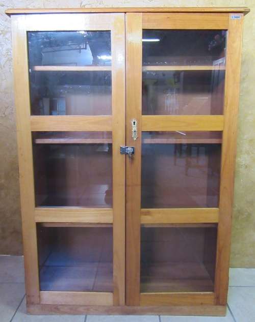 A STUNNING TWO DOOR SHOW/BOOK CASE FROM HEYSTECK RAND FURNITURE FACTORY A PRODUCT OF BOPHUTHATSWANA
