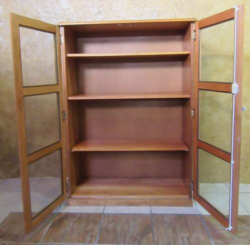 A STUNNING TWO DOOR SHOW/BOOK CASE FROM HEYSTECK RAND FURNITURE FACTORY A PRODUCT OF BOPHUTHATSWANA