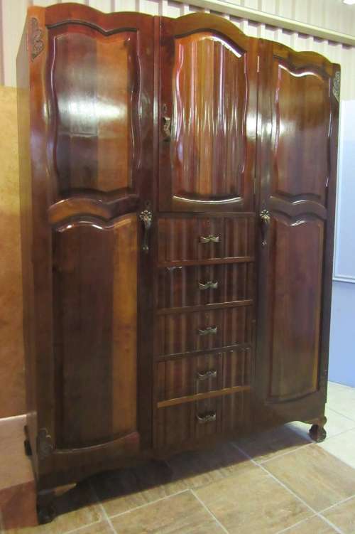 A stunning Three door solid Imbuia wardrobe with solid brass embellishments & ample space