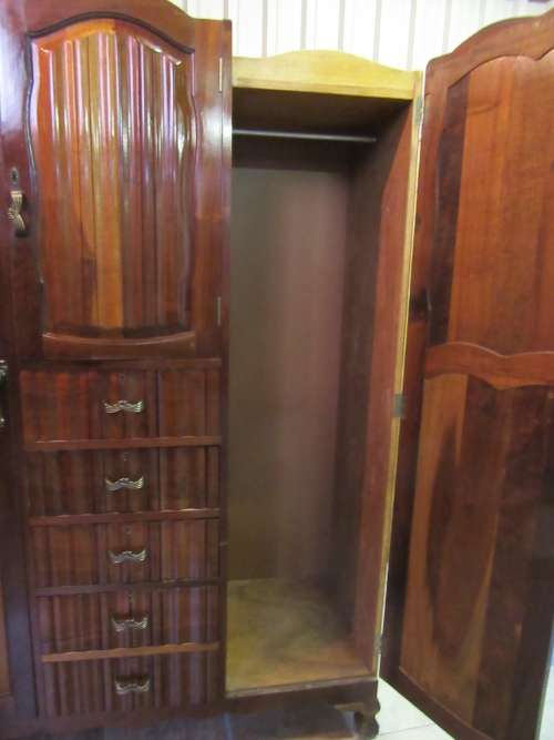 A stunning Three door solid Imbuia wardrobe with solid brass embellishments & ample space