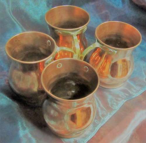 Four attractive antique tin-lined half pint copper mug or tankard with a brass handle.