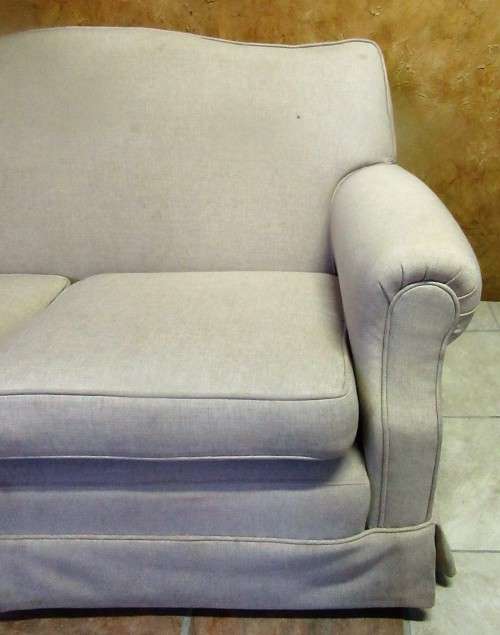 A VERY COMFORTABLE 2 SEATER COUCH IN GOOD CONDITTION