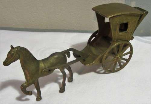 A ORNEMENTAL BRASS HORSE & CARRIAGE