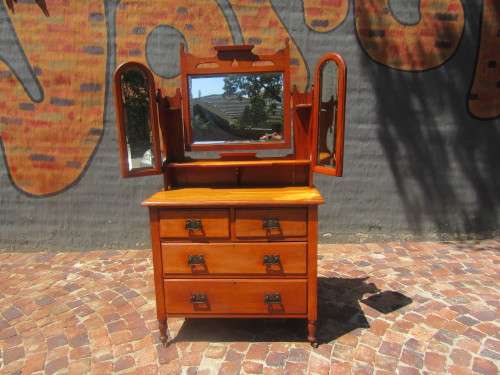 Gorgeous 1920's Solid Satinwood with the original bevelled Mirrors, Handles and wood Casters.