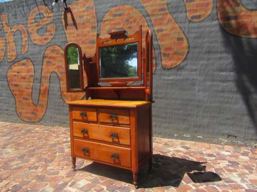 Gorgeous 1920's Solid Satinwood with the original bevelled Mirrors, Handles and wood Casters.