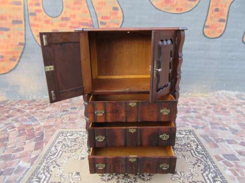 A beautiful Stinkwood ball and claw `Tallboy` multi-purpose cabinet with 3 drawers