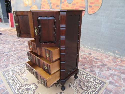 A beautiful Stinkwood ball and claw `Tallboy` multi-purpose cabinet with 3 drawers