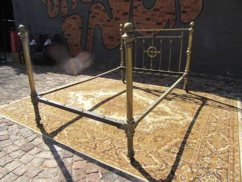 Antique Brass double bet on original casters