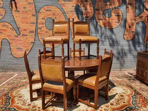 Stunning 8 seater Rhodesian Teak? Dining room table and chairs covered in leather.  R12950  +/- Heig