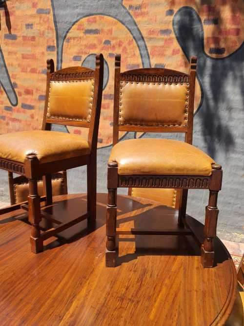 Stunning 8 seater Rhodesian Teak? Dining room table and chairs covered in leather.  R12950  +/- Heig