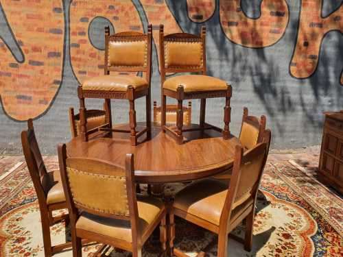 Stunning 8 seater Rhodesian Teak? Dining room table and chairs covered in leather.  R12950  +/- Heig