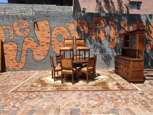 Stunning 8 seater Rhodesian Teak? Dining room table and chairs covered in leather.  R12950  +/- Heig