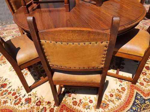 Stunning 8 seater Rhodesian Teak? Dining room table and chairs covered in leather.  R12950  +/- Heig
