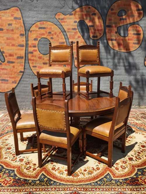 Stunning 8 seater Rhodesian Teak? Dining room table and chairs covered in leather.  R12950  +/- Heig