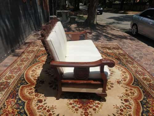 Beautifully carved three-seater imbuia Ball and Claw in good condition