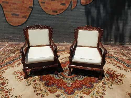 Pair of Beautifully carved  imbuia Ball and Claw Single Seaters armchairs good condition